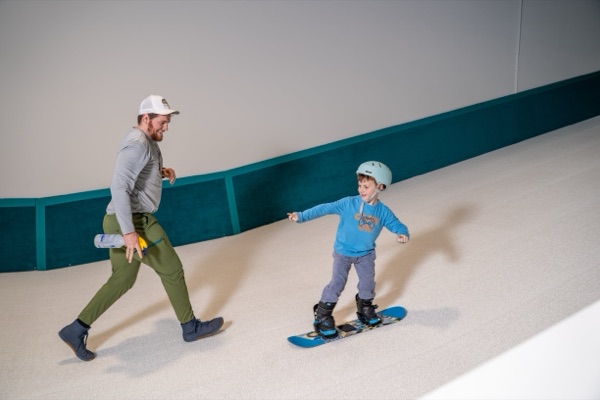 Child snowboarding at Shredder indoor slope