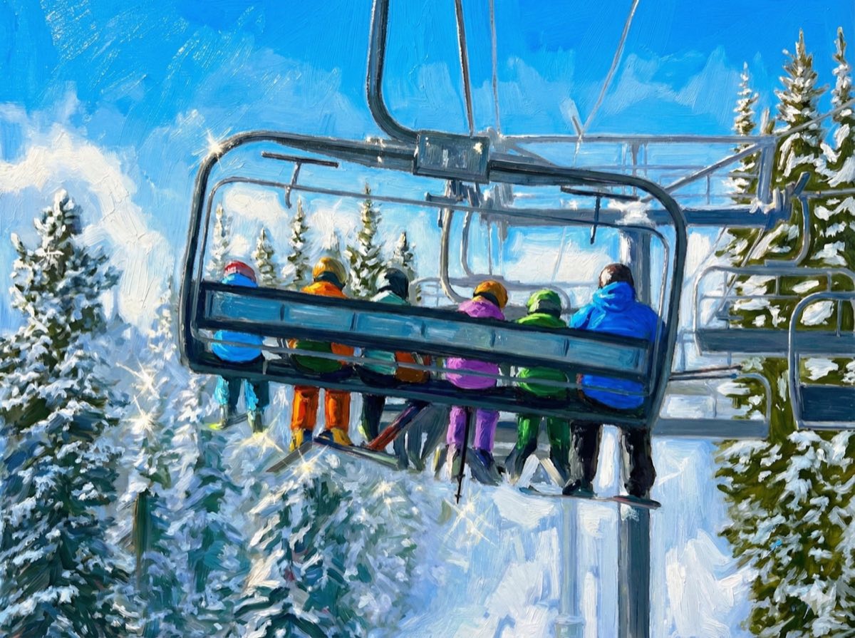 Family riding a ski chairlift together through snowy trees on a bluebird day