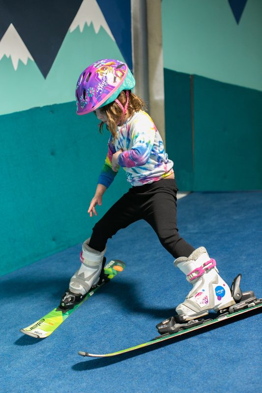 A young skier making her first turns at Shredder Central Park