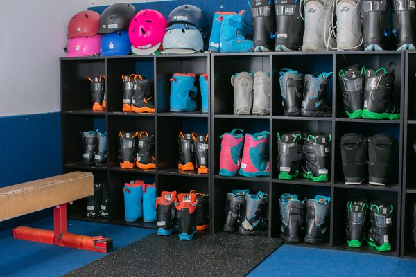 Fitted ski and snowboard boots on the shelves at Shredder Central Park