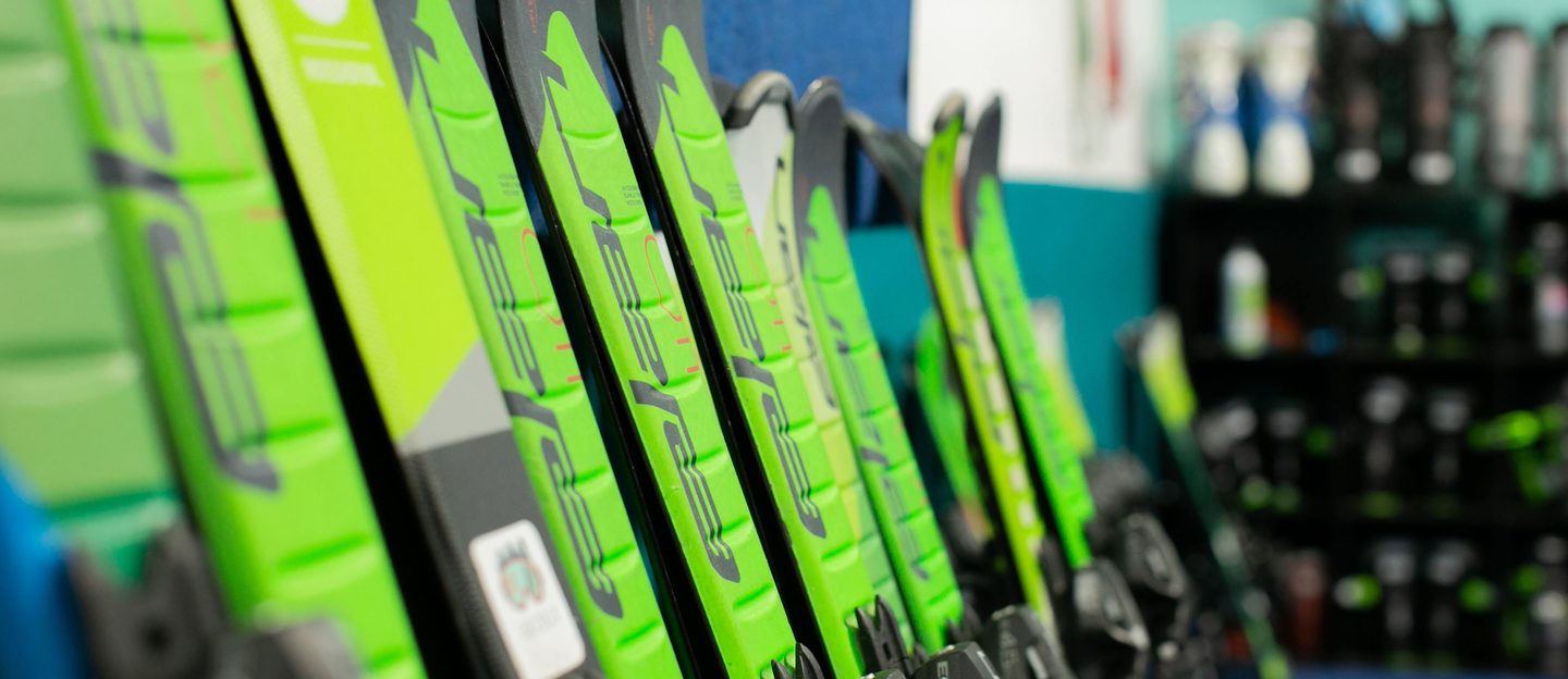 A rack of Shredder skis lined up ready for the season