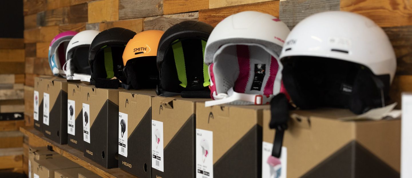 Helmets on the retail shelf, sized and ready to take on a trip