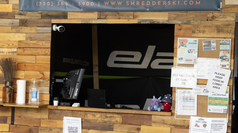 The front counter at Shredder Wheat Ridge, with the rental shop behind it