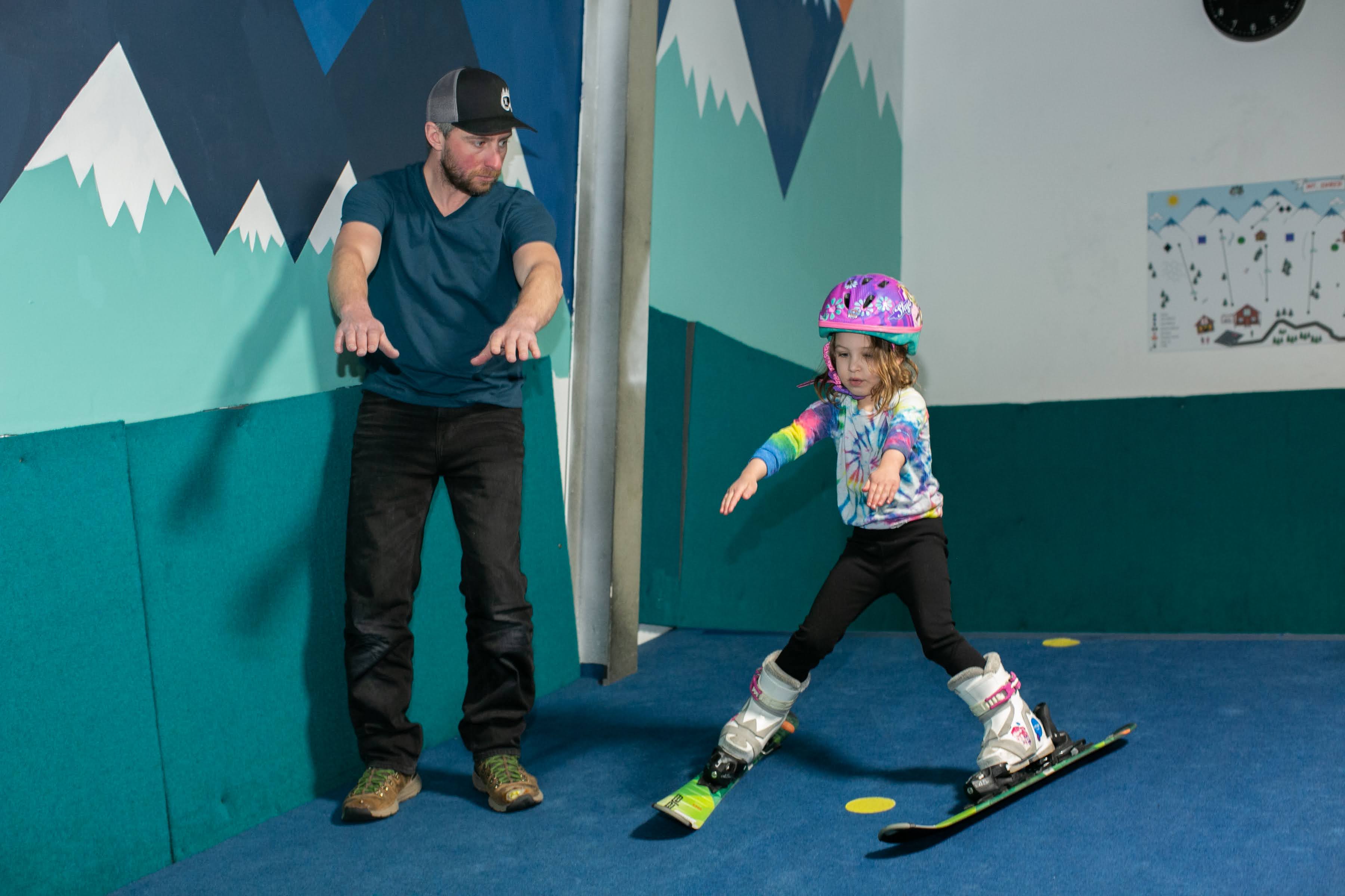 Girl learning to ski with instructor at Shredder Little Shredders program