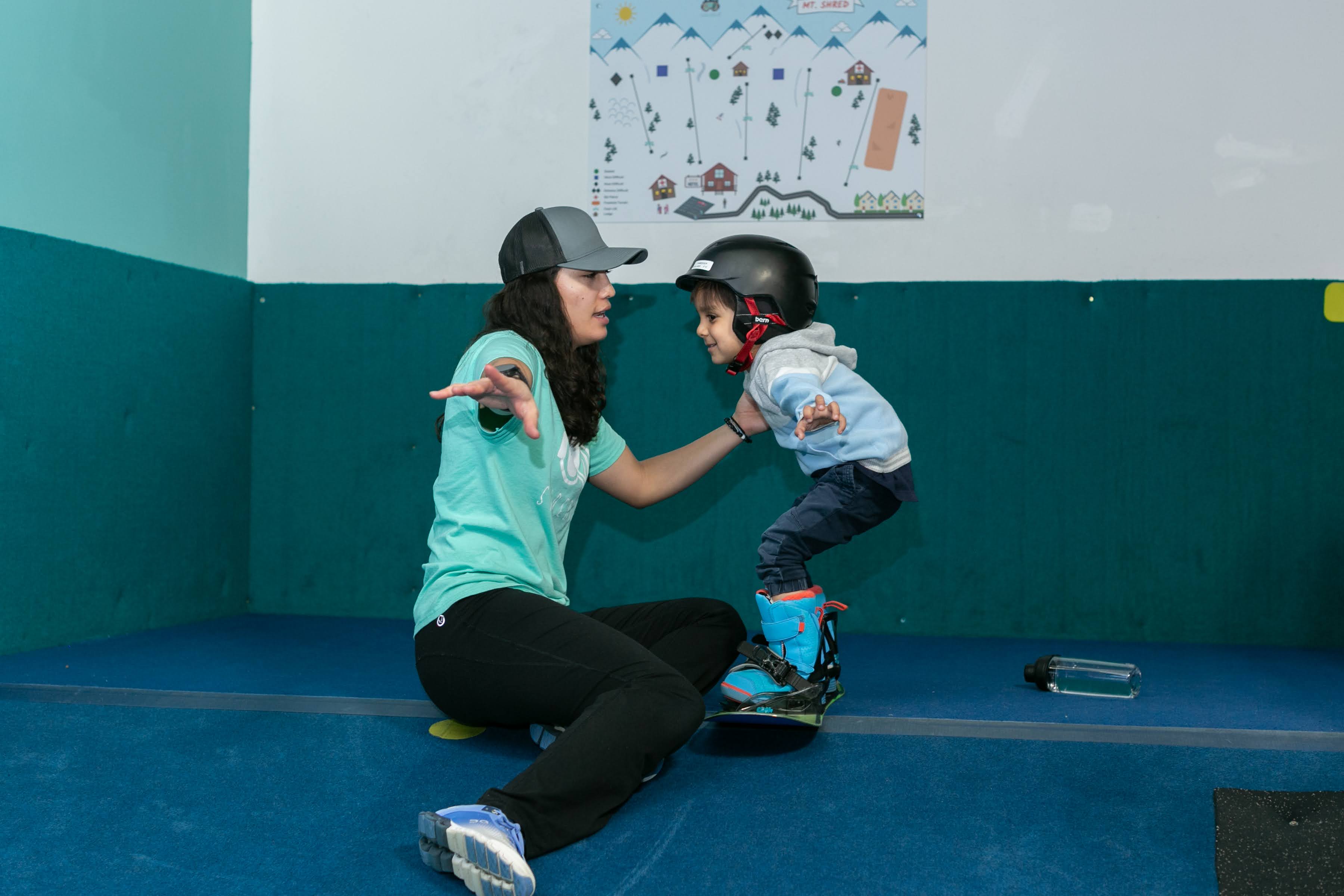 Instructor teaching toddlers to ski at Shredder Yeti School