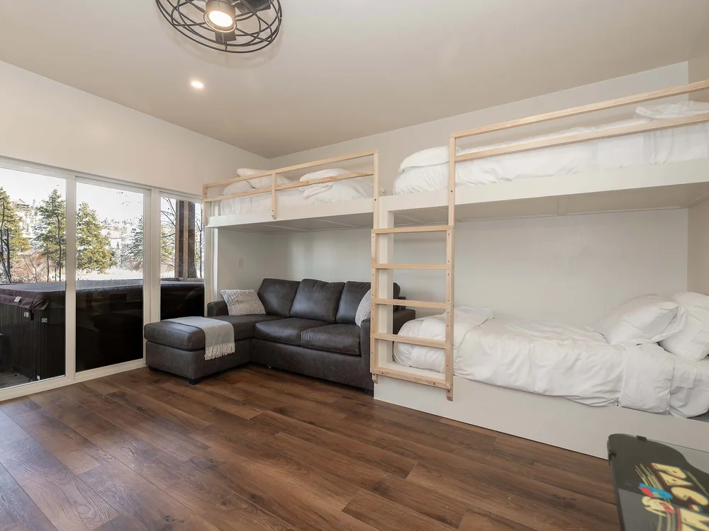 The Shred Haus bunk room, sleeping four with a sofa and arcade