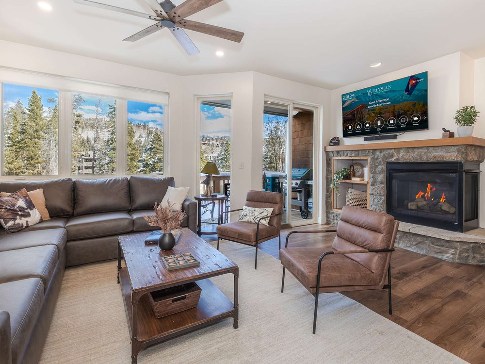 The Shred Haus living room with its stone fireplace lit