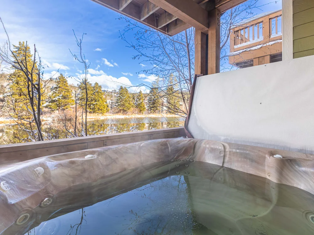 The Shred Haus hot tub overlooking the pond